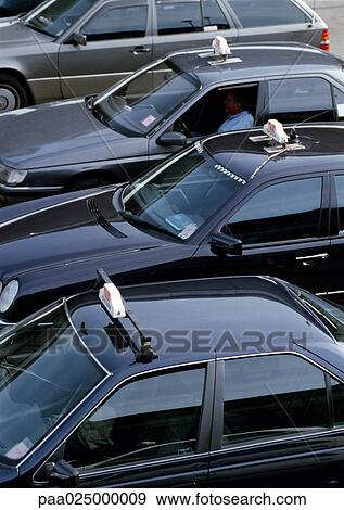 Black taxis in a row. View Large Photo Image Stock Photo - Black taxis in a row.. Fotosearch