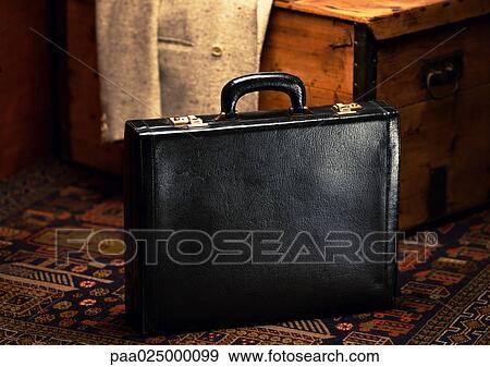 Stock Photo - Briefcase on floor. Fotosearch