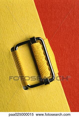 Buckle on yellow file View Large Photo Image Stock Photography - Buckle on yellow file. Fotosearch