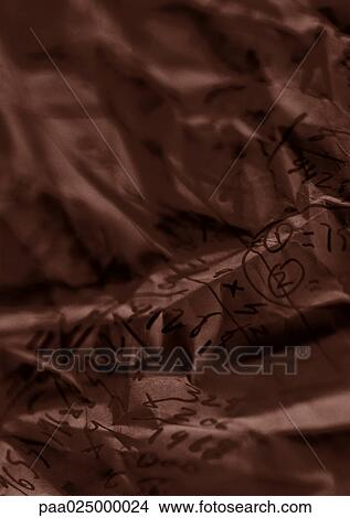 Crumpled paper with figures writen on it View Large Photo Image Picture - Crumpled paper with figures writen on it. Fotosearch