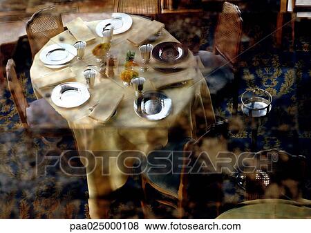 Fancy dining table setup and reflection View Large Photo Image Stock Photo - Fancy dining table setup and reflection. Fotosearch