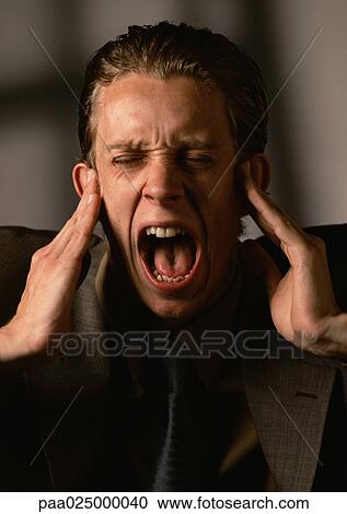 Man covering ears and screaming. View Large Photo Image Stock Image - Man covering ears and screaming.. Fotosearch