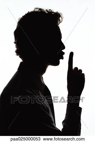 Man holding finger out in front of lips, silhouette. View Large Photo Image Stock Image - Man holding finger out in front of lips, silhouette.. Fotosearch