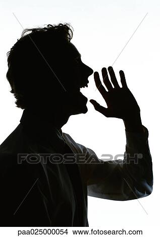 Man yelling with hand out in front of mouth, silhouette. View Large Photo Image Picture - Man yelling with hand out in front of mouth, silhouette.. Fotosearch
