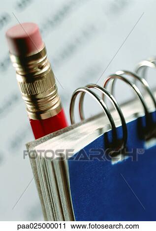 Stock Image - Notepad with pencil, close-up. Fotosearch