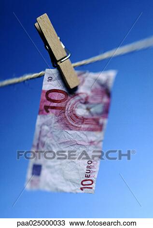 Ten euro bill hanging on clothesline with clothes peg, close-up. View Large Photo Image Stock Image - Ten euro bill hanging on clothesline with clothes peg, close-up.. Fotosearch