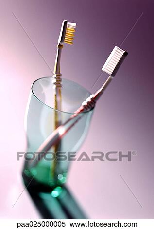 Toothbrushes in glass View Large Photo Image Stock Photography - Toothbrushes in glass. Fotosearch