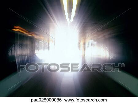 Stock Photograph - Tunnel with light, blurry.. Fotosearch
