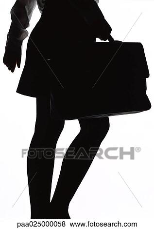 Woman walking with briefcase, silhouette. View Large Photo Image Stock Photo - Woman walking with briefcase, silhouette.. Fotosearch