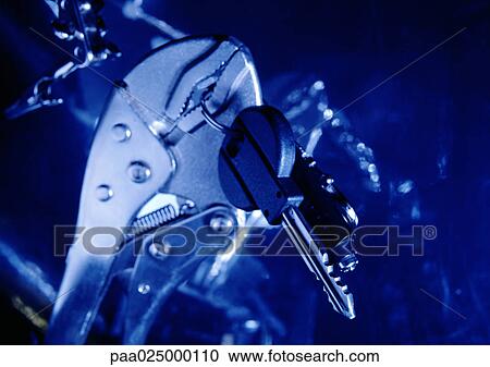 Wrench holding keys. View Large Photo Image Stock Image - Wrench holding keys.. Fotosearch