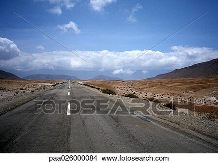 Chile, El Norte Grande, road through desert, low horizon, vanishing point. View Large Photo Image Picture - Chile, El Norte Grande, road through desert, low horizon, vanishing point.. Fotosearch