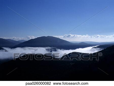 France, Alpes, mountain top surrounded by clouds. View Large Photo Image Stock Image - France, Alpes, mountain top surrounded by clouds.. Fotosearch