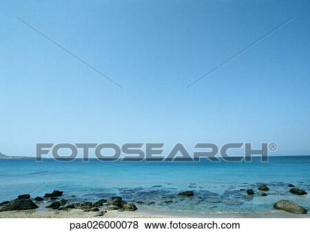 Greece, Cyclades, seashore with low horizon. View Large Photo Image Stock Photo - Greece, Cyclades, seashore with low horizon.. Fotosearch