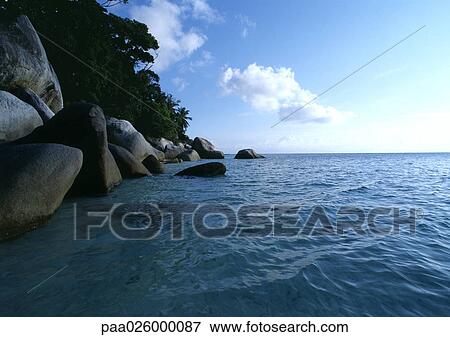 Malaysia, ocean with rocky shore. View Large Photo Image Stock Photo - Malaysia, ocean with rocky shore.. Fotosearch