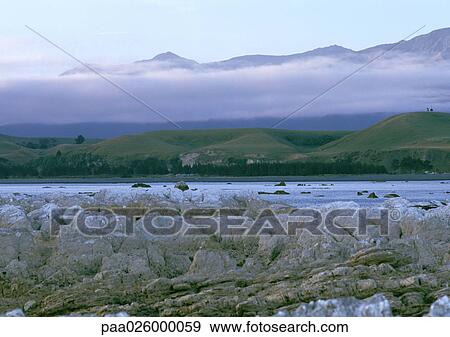 New Zealand, mountainscape with low-lying clouds. View Large Photo Image Stock Photo - New Zealand, mountainscape with low-lying clouds.. Fotosearch