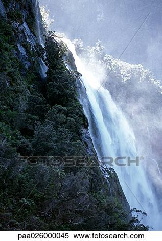 New Zealand, waterfall over cliff. View Large Photo Image Stock Photography - New Zealand, waterfall over cliff.. Fotosearch