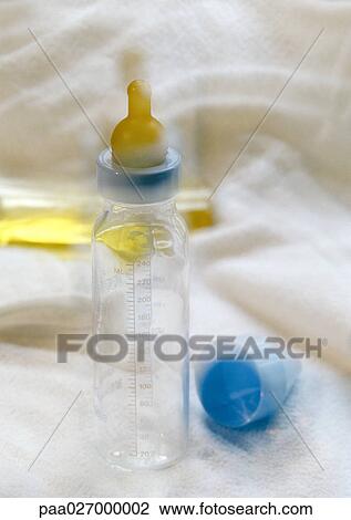 Baby bottle, blurred View Large Photo Image Stock Image - Baby bottle, blurred. Fotosearch
