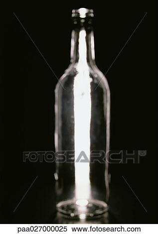 Bottle against black background View Large Photo Image Stock Photography - Bottle against black background. Fotosearch