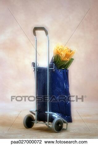 Stock Image - Caddy with bouquet of flowers. Fotosearch