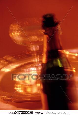 Champagne bottle and champagne glass on tray, blurred View Large Photo Image Stock Photograph - Champagne bottle and champagne glass on tray, blurred. Fotosearch