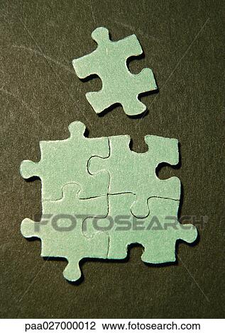 Four connected puzzle pieces and one separate piece, close-up View Large Photo Image Stock Image - Four connected puzzle pieces and one separate piece, close-up. Fotosearch