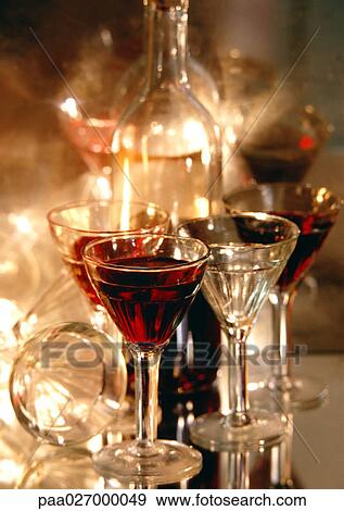 Glasses of wine and wine bottles View Large Photo Image Stock Photo - Glasses of wine and wine bottles. Fotosearch