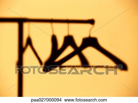 Hangers hanging on rack View Large Photo Image Picture - Hangers hanging on rack. Fotosearch