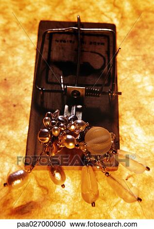Jewelery on mousetrap, close-up, high angle view View Large Photo Image Stock Image - Jewelery on mousetrap, close-up, high angle view. Fotosearch