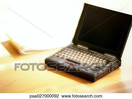 Laptop computer on table, blurred View Large Photo Image Stock Image - Laptop computer on table, blurred. Fotosearch