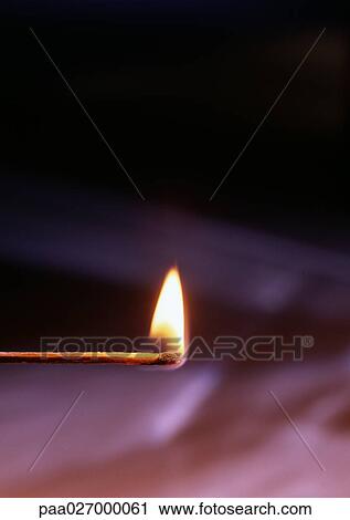 Lit match on dark background View Large Photo Image Stock Image - Lit match on dark background. Fotosearch