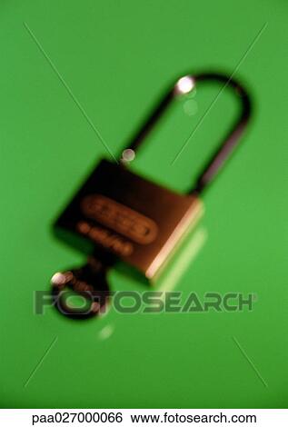 Padlock and key, close-up, blurred View Large Photo Image Stock Photograph - Padlock and key, close-up, blurred. Fotosearch