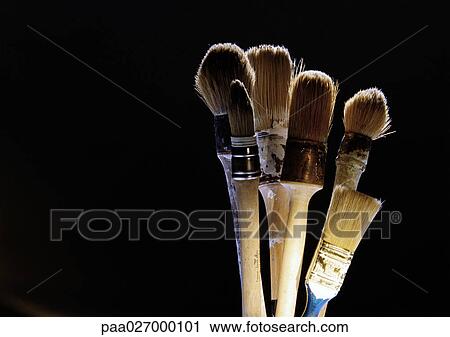 Stock Image - Paintbrushes on black background. Fotosearch