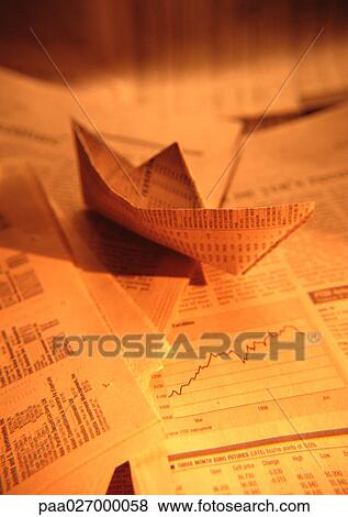 Paper boat made from financial documents, close-up View Large Photo Image Stock Photo - Paper boat made from financial documents, close-up. Fotosearch