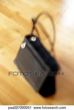 Purse on floor, blurred View Large Photo Image Stock Image - Purse on floor, blurred. Fotosearch