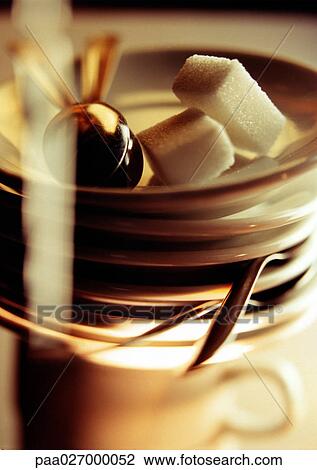 Sugar cubes on stack of saucers and spoons, close-up View Large Photo Image Stock Image - Sugar cubes on stack of saucers and spoons, close-up. Fotosearch