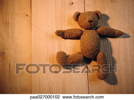 Teddy bear on wooden planks View Large Photo Image Stock Image - Teddy bear on wooden planks. Fotosearch