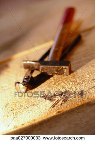 Tools and nails on wooden board View Large Photo Image Stock Image - Tools and nails on wooden board. Fotosearch