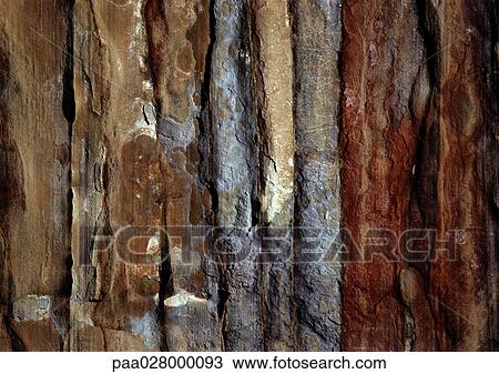Stock Image - Mottled, textured, stone surface, close-up. Fotosearch