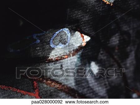Stock Image - Red and blue painted on textured black background.. Fotosearch