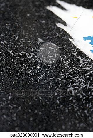 Stock Image - Torn paper on black background.. Fotosearch
