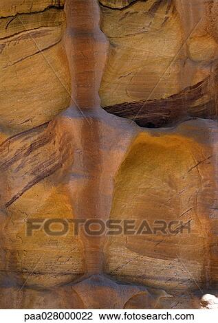 Stock Image - Water in between rocks.. Fotosearch