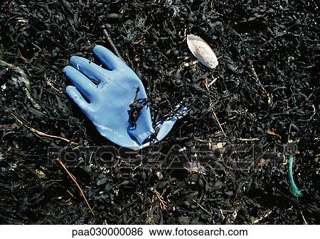 Blue plastic glove in dirt. View Large Photo Image Stock Photograph - Blue plastic glove in dirt.. Fotosearch