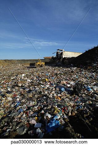 Bulldozer in landfill. View Large Photo Image Stock Image - Bulldozer in landfill.. Fotosearch