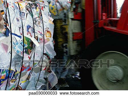 Bundled up paper next to transporter. View Large Photo Image Stock Image - Bundled up paper next to transporter.. Fotosearch