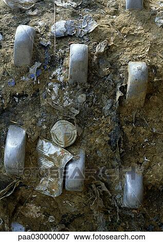 Dirt and trash in between metal spikes. View Large Photo Image Stock Photo - Dirt and trash in between metal spikes. . Fotosearch