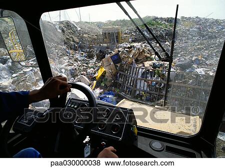 Landfill, view from inside bulldozer. View Large Photo Image Stock Photo - Landfill, view from inside bulldozer.. Fotosearch