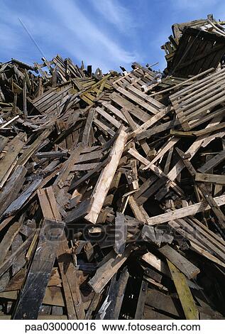Large heap of wooden planks and pallets, blue sky in background. View Large Photo Image Stock Photograph - Large heap of wooden planks and pallets, blue sky in background.. Fotosearch