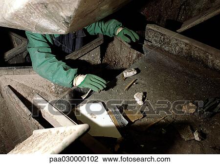 Stock Image - Man separating trash falling down shoot.. Fotosearch