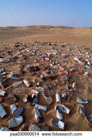 Metal cans scattered over desert terrain. View Large Photo Image Picture - Metal cans scattered over desert terrain.. Fotosearch