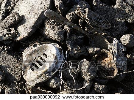 Metal objects mixed in with rocks. View Large Photo Image Stock Image - Metal objects mixed in with rocks.. Fotosearch